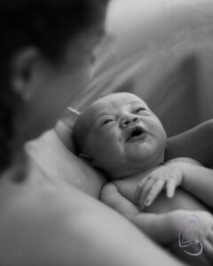 A newborn baby in a birth pool just born