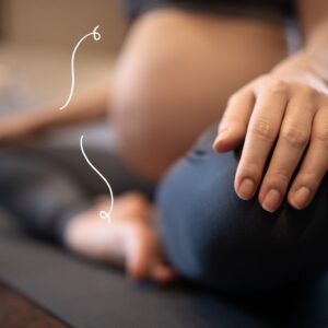 Pregnant mum holding bump, calm and relaxed