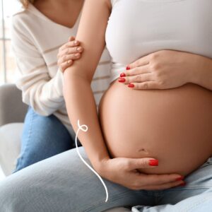 Pregnant woman being supported by a Doula