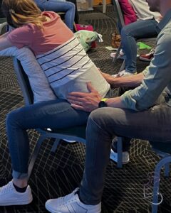 Pregnant parent practising hypnobirthing techniques with doula support in Berkshire